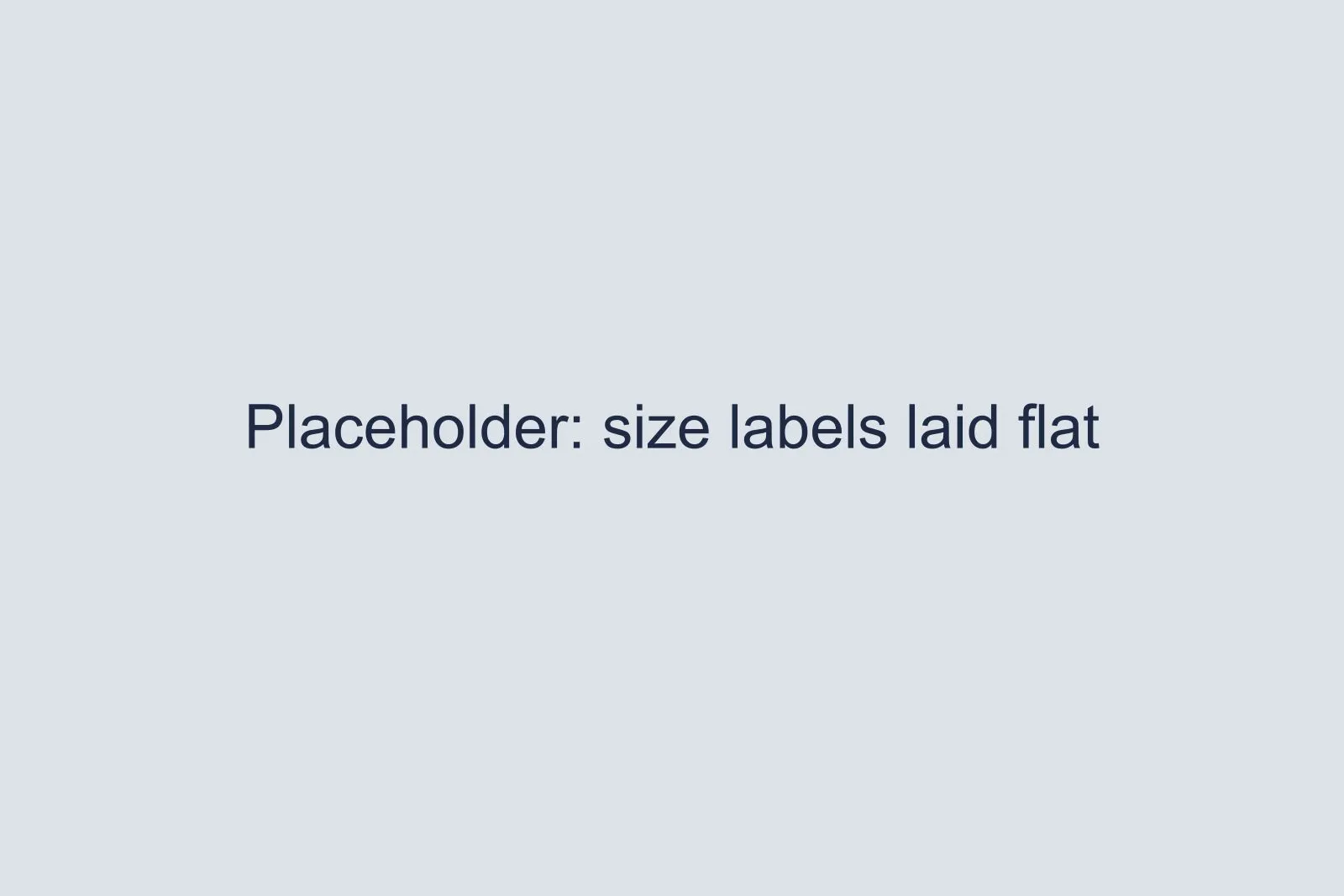 Placeholder for three shirt size labels laid flat on a table